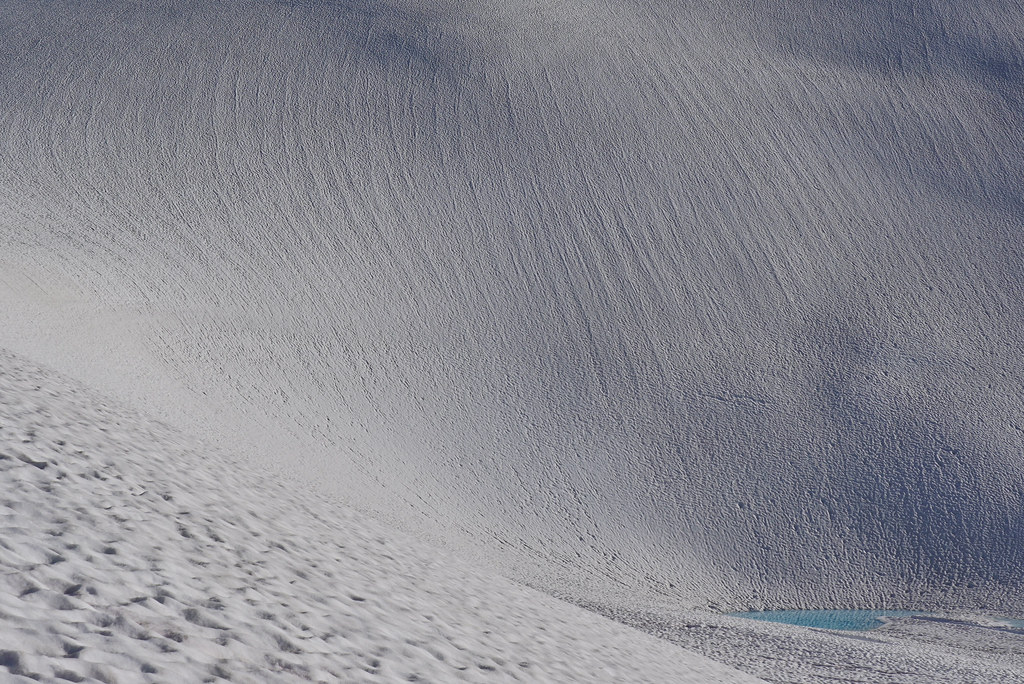 Huge snow slope just above the highest glacial lake east of Mount Hinman
