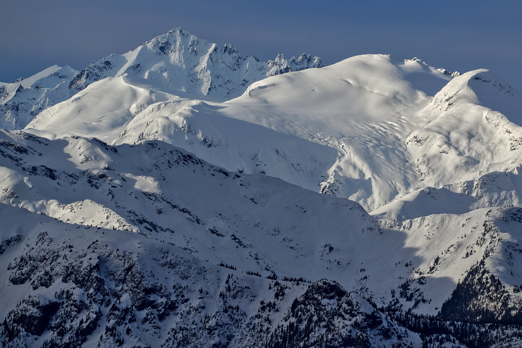 Mount James Turner (the spiky one left of the center) and Mount Neal (the white dome at the right)